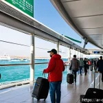 키프로스와 그리스 간 페리 - A vibrant scene of a modern ferry terminal in Limassol, Cyprus, bustling with travelers preparing fo...